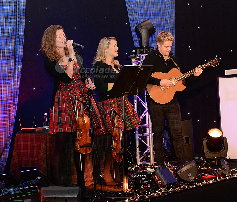 Tartan clad band at a Scottish themed company party