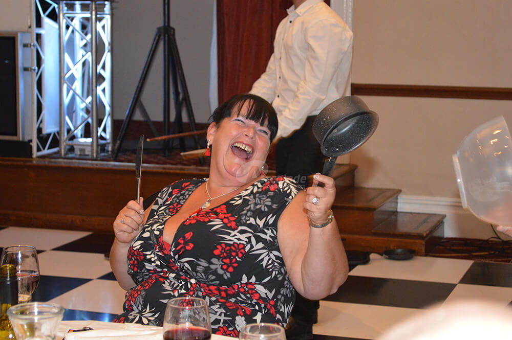 Lady laughing at Crashing Waiters corporate evening event