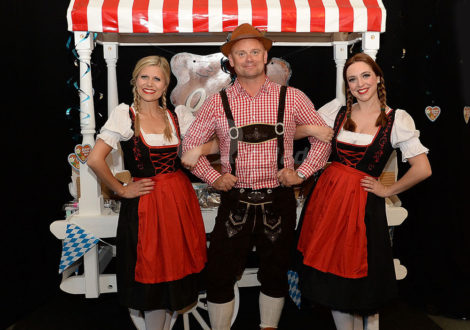 Man in lederhosen and Fraulines and German Beer Festival Event