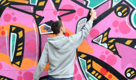 Man painting graffiti for Graffiti workshop event