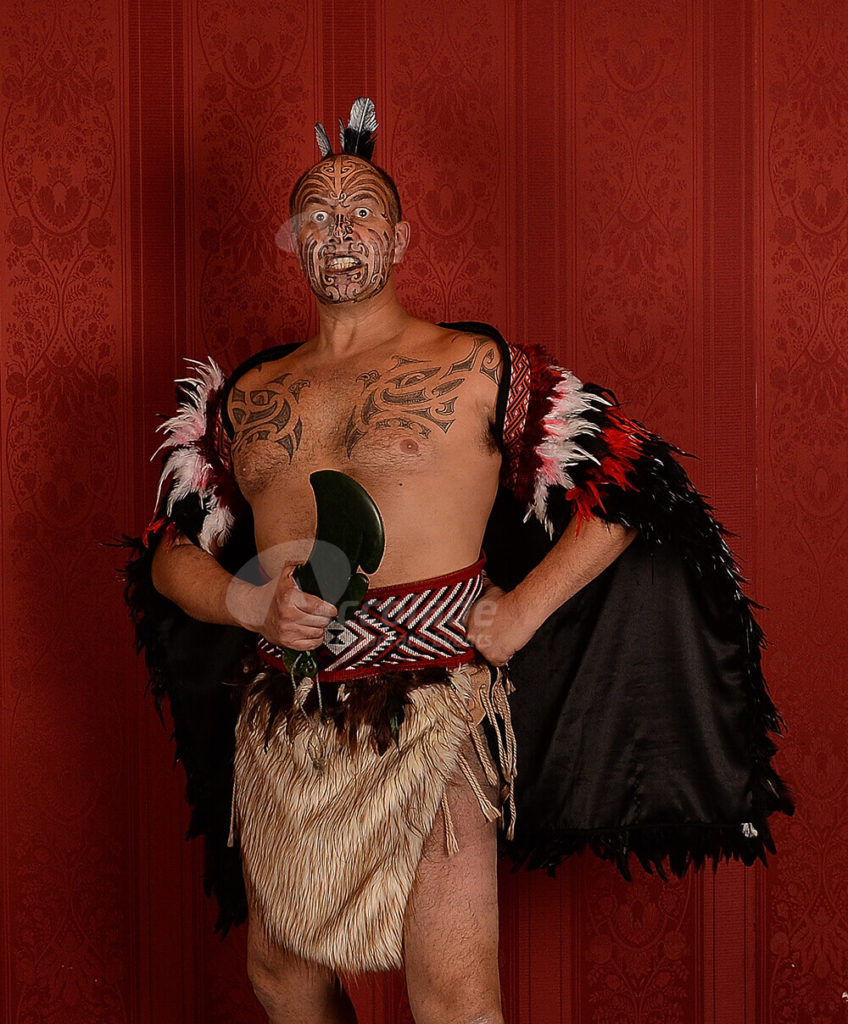 Maori Haka master posing at team building event