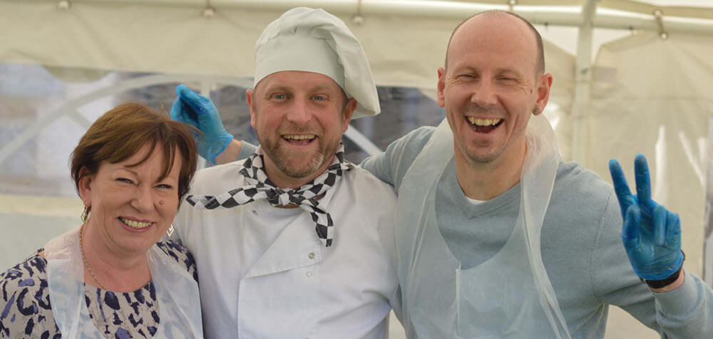 People laughing at Team Bake Off team building event