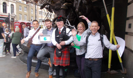 Team with bagpiper on Treasure hunt team building event