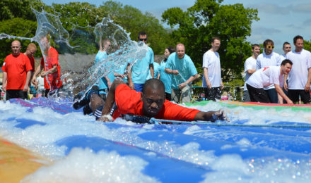 Man on foam filled inflatable its a knockout total wipe out event