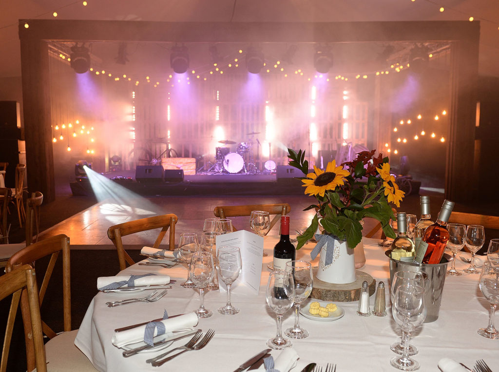 Country Chic Corporate Event Sunflowers and Stage Lighting