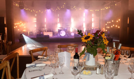 Country Chic Corporate Event Sunflowers and Stage Lighting