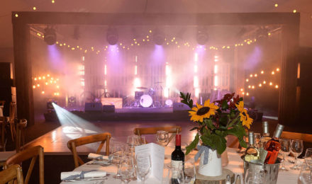 Country Chic Corporate Event Sunflowers with and Stage Lighting