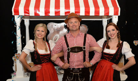 Man and women in costume at German Beer Festival company event