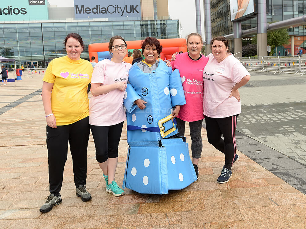 Women posing at Media City for It's a Knockout company event