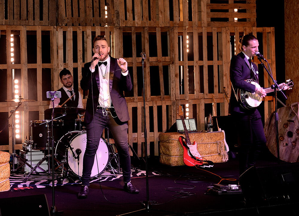 Gritty band on stage at a company party