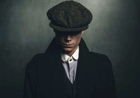 Man dressed as Peaky Blinder in cap for Peaky Blinders party