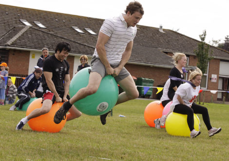 Man on a space hopper at School Sports Day team building