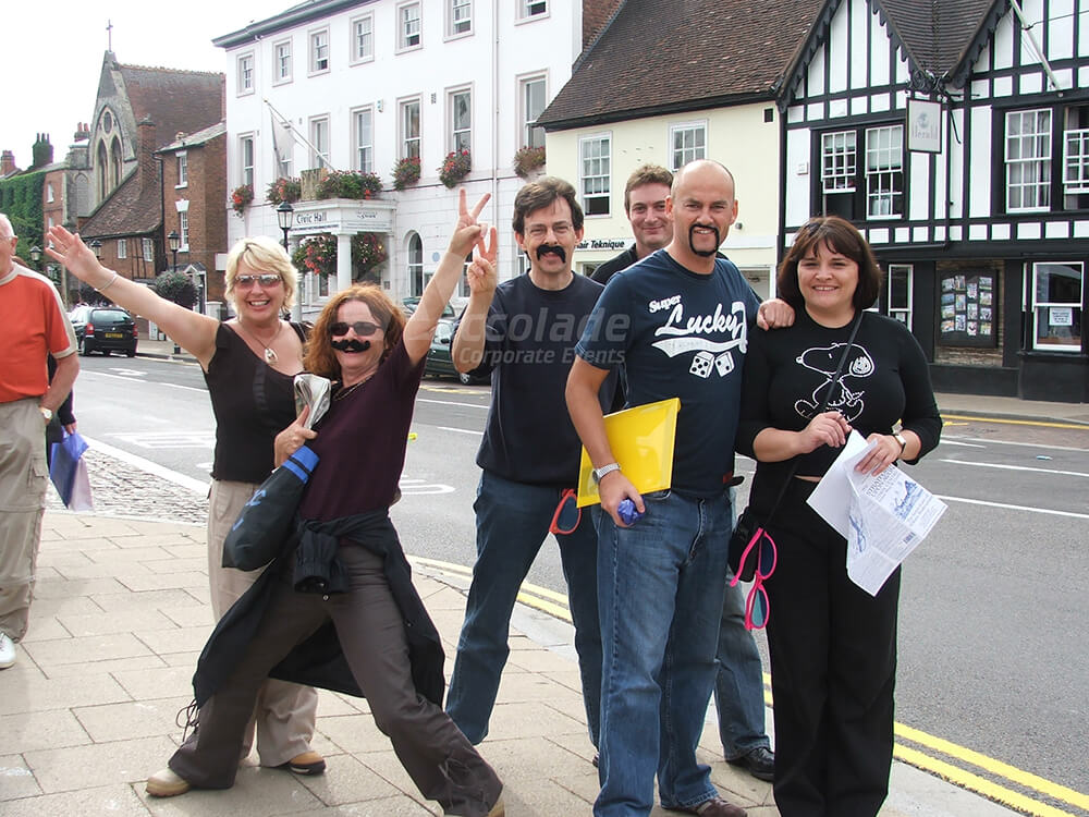 Group with moustaches on Treasure hunt team building event