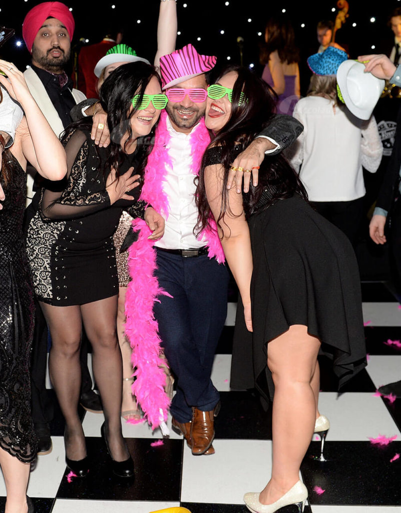 Happy party guests at company Christmas party